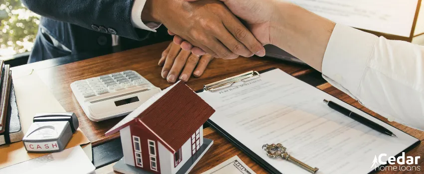 CHL - Home buyer and sales agent shaking hands